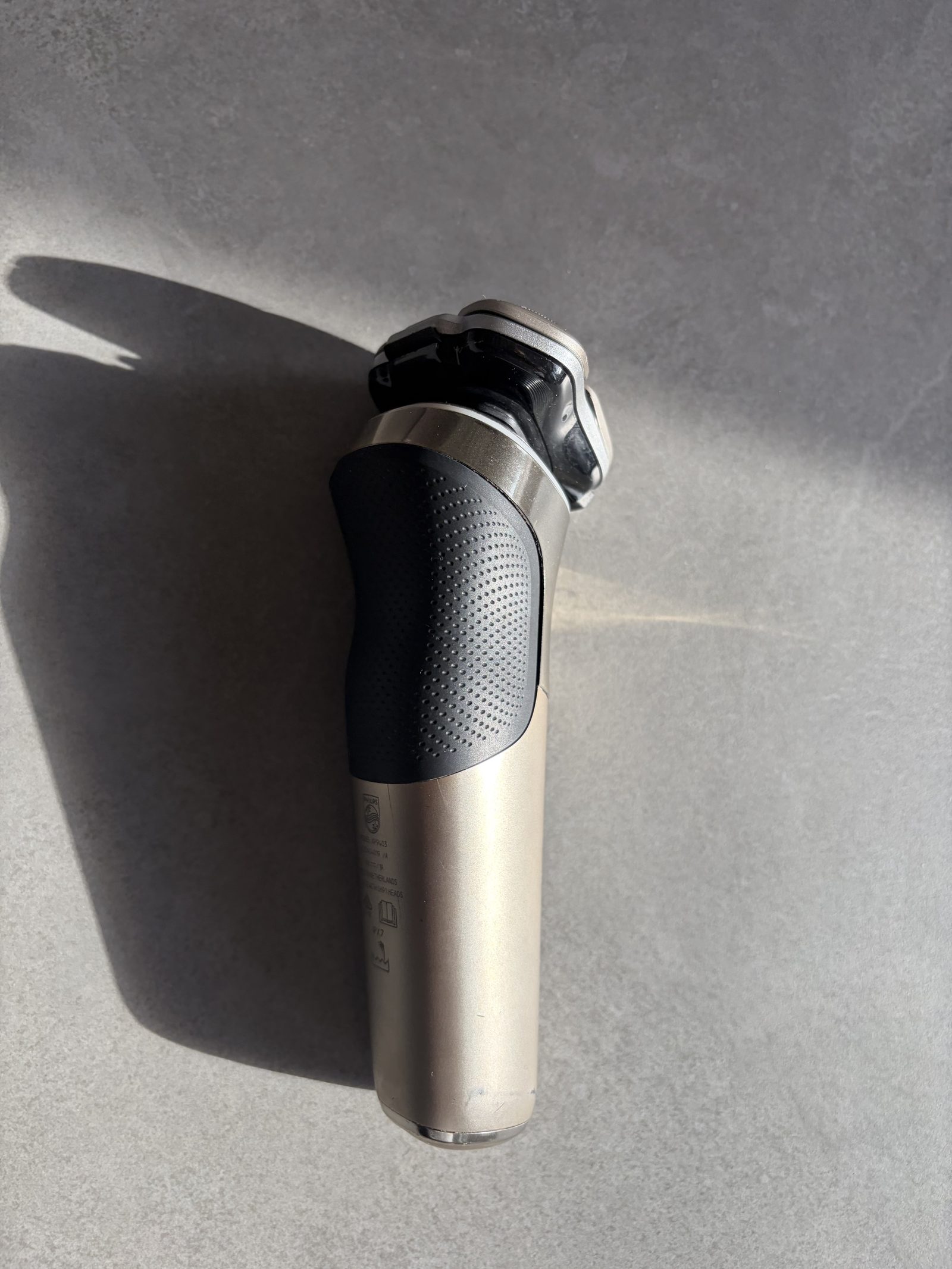 The back of the Philips, textured grip and model label