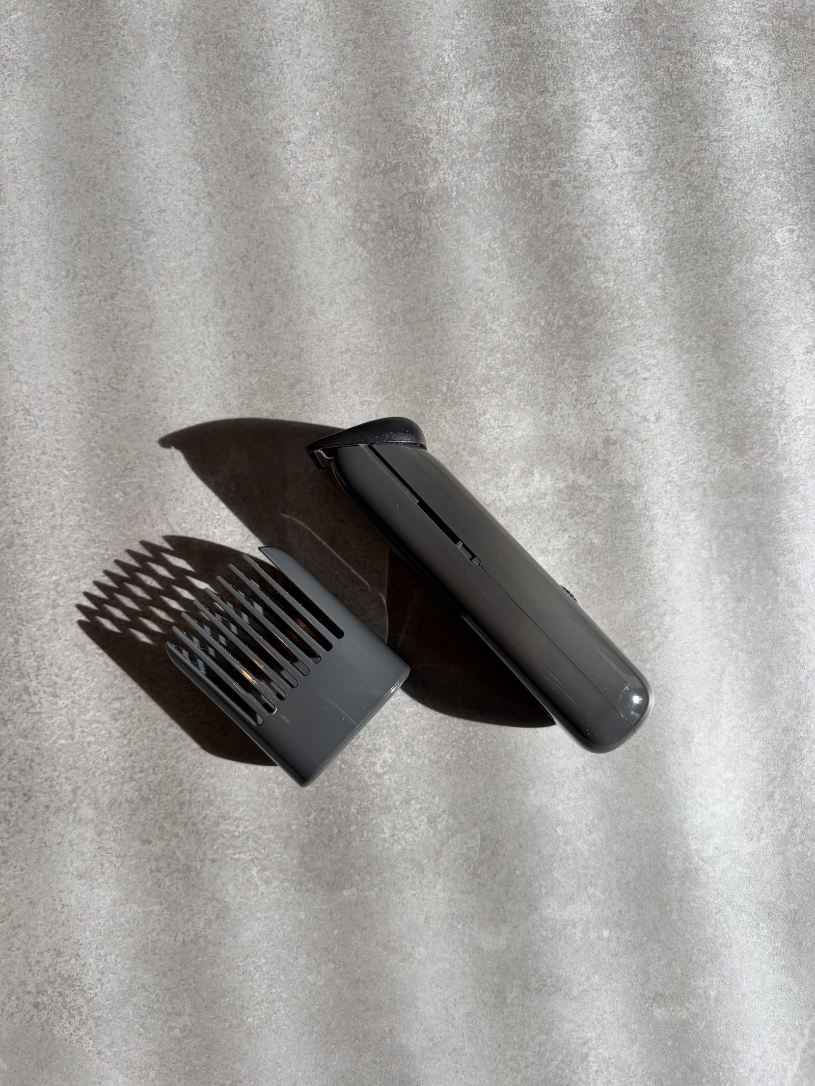 The Stamen ST-01 in profile beside its comb